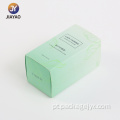 Design elegante de caixa de perfume com folhas verdes